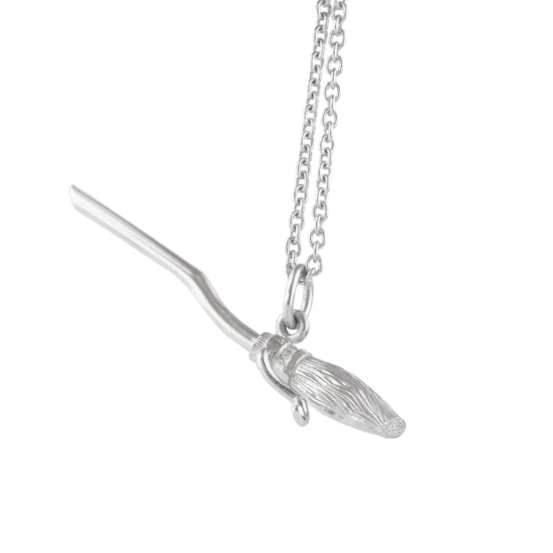 Officially licensed Harry Potter Firebolt pendant in sterling silver on a white background. Also available in solid 14k and 18k yellow gold and platinum.