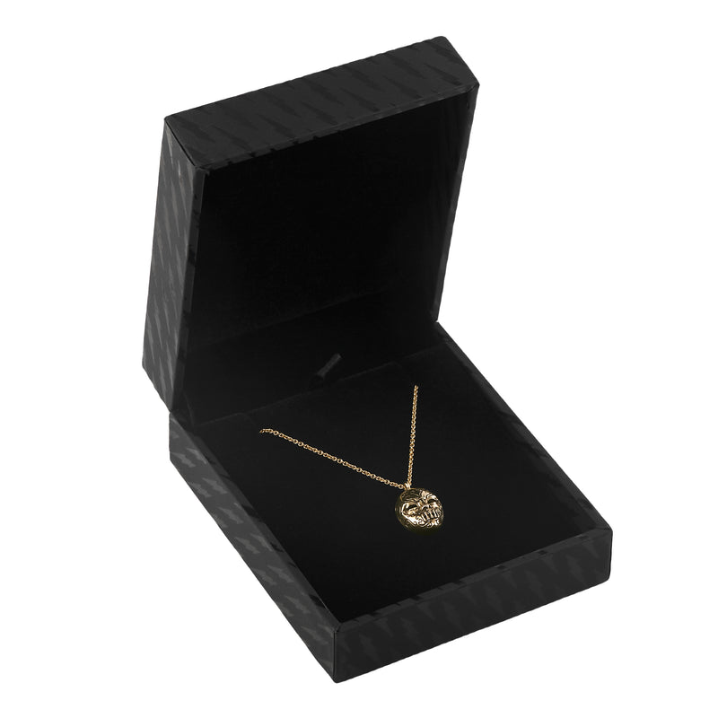 Officially licensed Bellatrix LeStrange death eater mask pendant in solid 14k gold in a black necklace box on a white background. Also available in sterling silver, 14k white gold, and platinum.