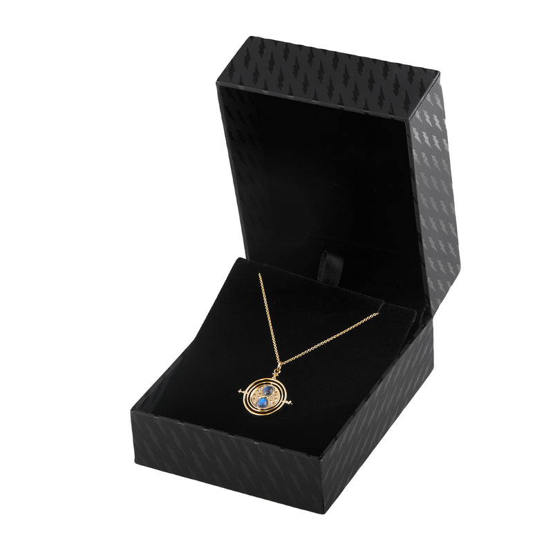 Officially licensed Harry Potter spinning Time Turner necklace in 14k yellow gold set with natural moonstones and diamonds in a black jewelry box on a white background. Also available in 14k white, 18k rose, 18k yellow gold, and platinum. 
