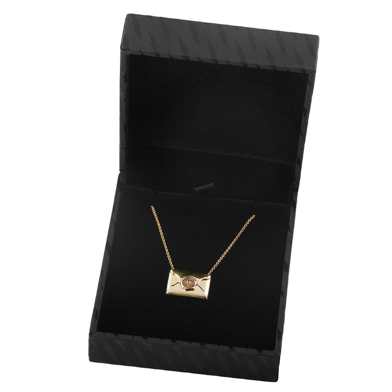 Officially licensed Harry Potter Hogwarts Acceptance Letter Necklace in solid 14k yellow gold in a black jewelry box on a white background. Also available in sterling silver, 14k white gold, 18k yellow gold, and platinum.