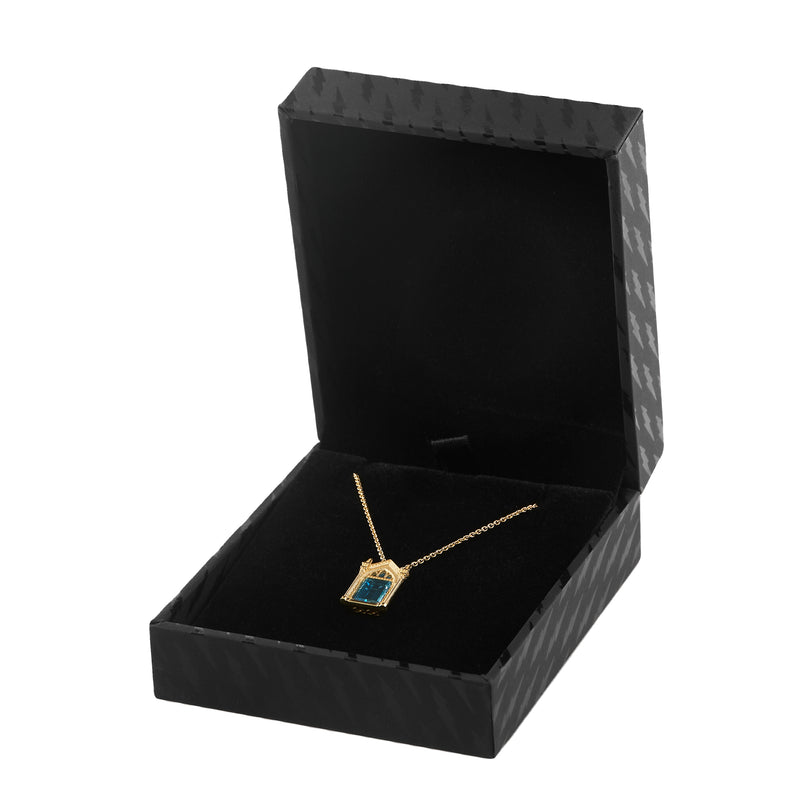 Officially licensed Harry Potter Mirror of Erised necklace in solid 14k yellow gold set with natural topaz resting in a black ring box on a white background. Also available in sterling silver, 14k white gold, 18k yellow gold, and platinum.