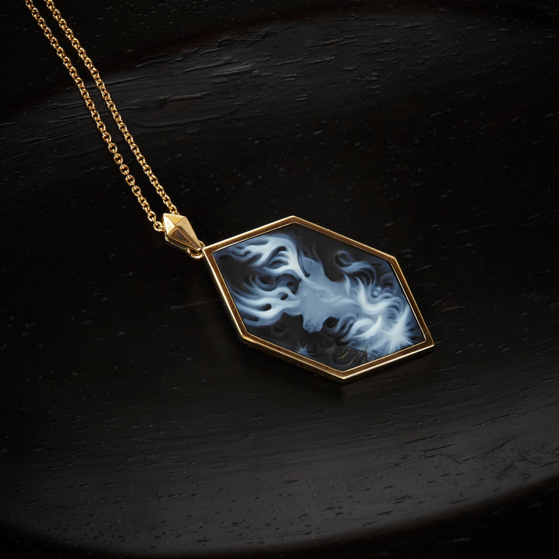 Officially licensed Harry Potter Patronus Cameo Necklace featuring a hand-carved agate set in solid 14k yellow gold on a black background. Also available in sterling silver, 14k white gold, 18k yellow gold, and platinum.