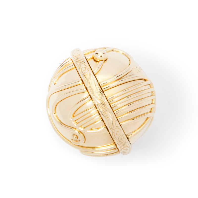 Close view of intricately carved center ring on officially licensed Harry Potter Golden Snitch Ring box in solid 14k yellow gold without wings on a white background. Also available in gold plated sterling silver and platinum. 