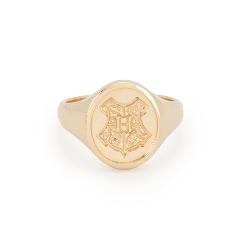 Officially licensed Harry Potter Hogwarts Crest Ring in solid 14k yellow gold on a white background. Also available in sterling silver, 14k white gold, 18k yellow gold, and platinum.