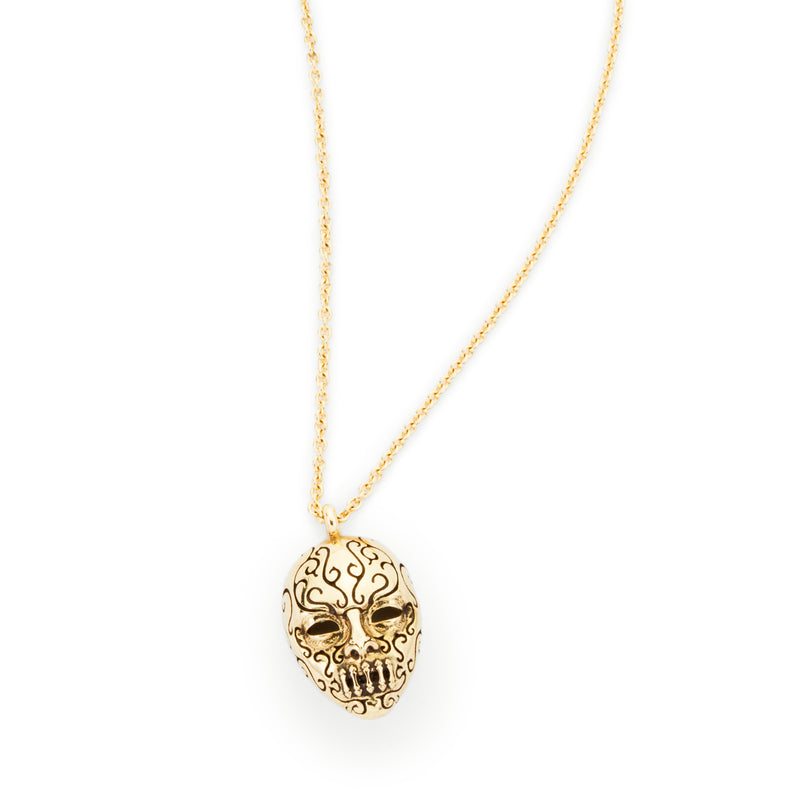 Officially licensed Bellatrix LeStrange death eater mask pendant in solid 14k gold on a white background. Also available in sterling silver, 14k white gold, and platinum. 