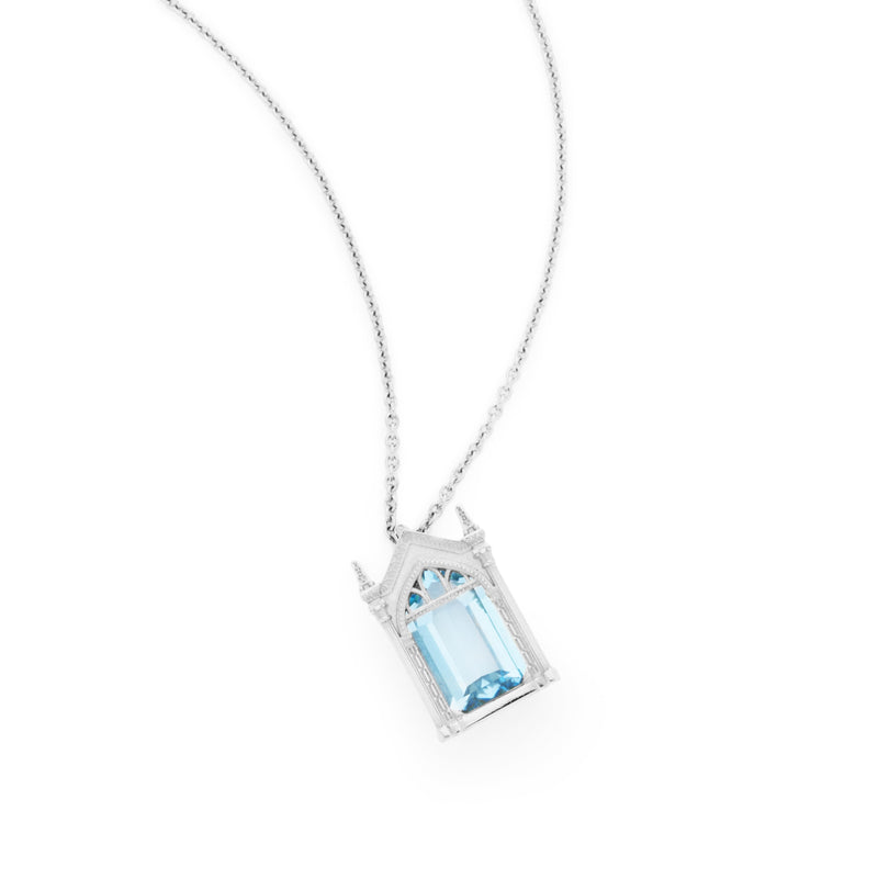 Officially licensed Harry Potter Mirror of Erised necklace in sterling silver set with natural topaz on a white background. Also available in 14k white or yellow gold, 18k yellow gold, and platinum.